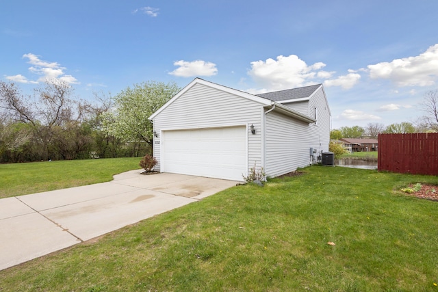 3332 Hampton Downs Dr SE, Kentwood, MI 49512 - view of side of home with a garage, central AC, fence, a lawn, and driveway