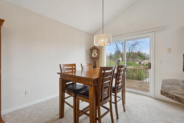 3332 Hampton Downs Dr SE, Kentwood, MI 49512 - dining area with baseboards, lofted ceiling, a notable chandelier, and light carpet