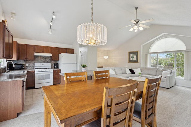 3332 Hampton Downs Dr SE, Kentwood, MI 49512 - dining area featuring ceiling fan with notable chandelier and lofted ceiling