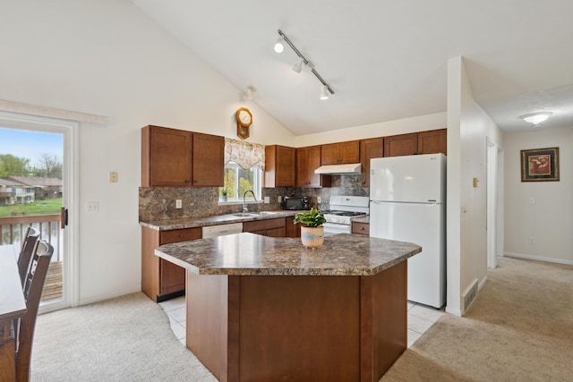 3332 Hampton Downs Dr SE, Kentwood, MI 49512 - kitchen with white appliances, light colored carpet, under cabinet range hood, and a sink