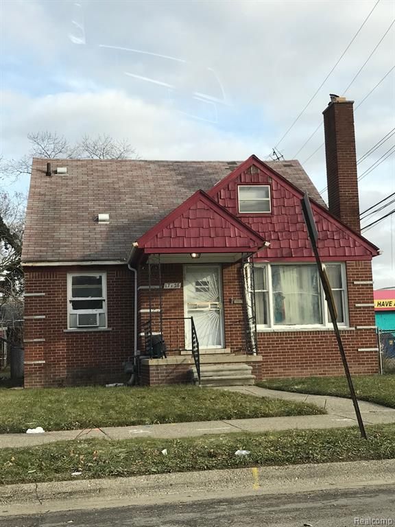 view of front of home featuring brick siding, a shingled roof, and cooling unit