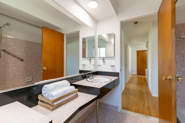 bathroom featuring vanity and a shower