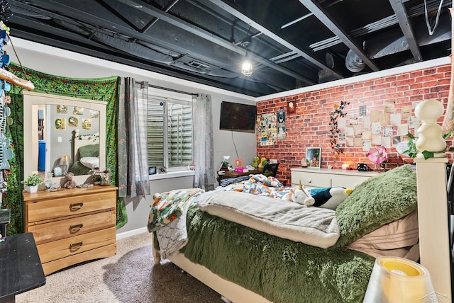 carpeted bedroom featuring brick wall and baseboards