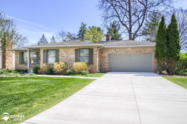 ranch-style house with a chimney, a front yard, brick siding, concrete driveway, and an attached garage