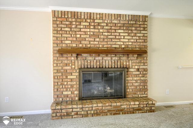 details featuring visible vents, crown molding, a brick fireplace, baseboards, and carpet flooring