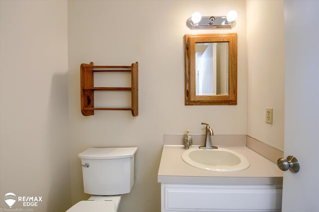 half bath with toilet and vanity