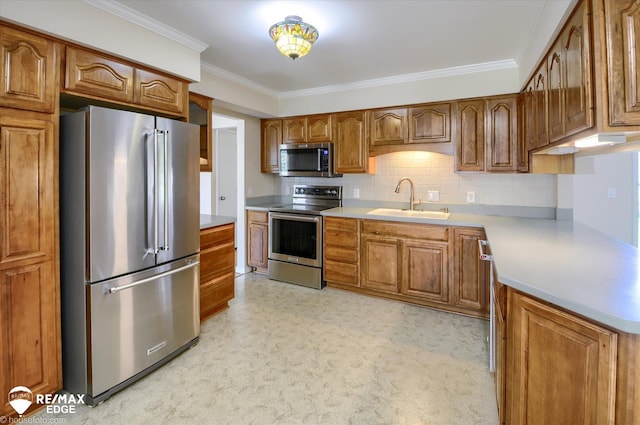 kitchen featuring brown cabinets, appliances with stainless steel finishes, a sink, tasteful backsplash, and ornamental molding