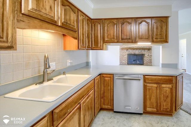 kitchen with crown molding, a sink, dishwasher, and light carpet