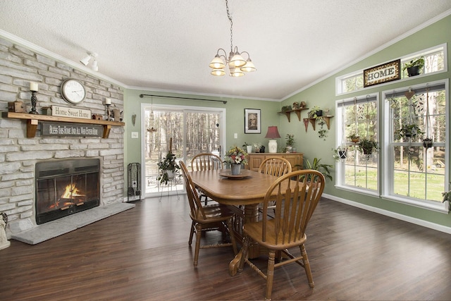 dining area with crown molding, plenty of natural light, a textured ceiling, and a chandelier