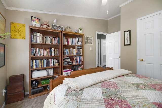bedroom with crown molding, baseboards, carpet, and a textured ceiling