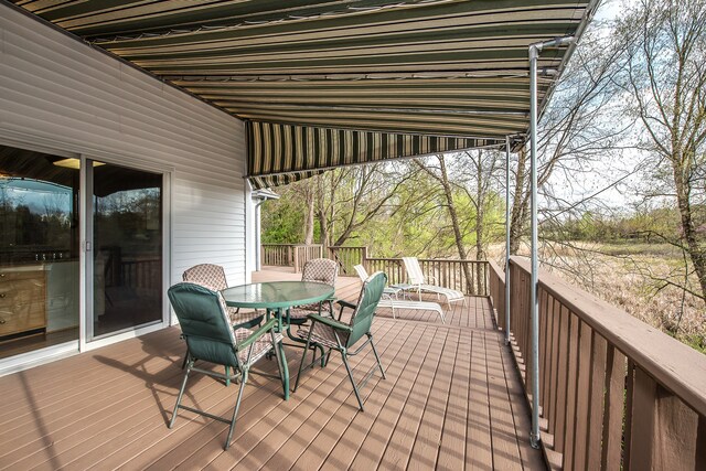 wooden deck with outdoor dining area