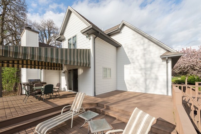 wooden deck featuring outdoor dining space
