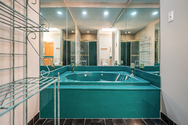 bathroom with toilet, recessed lighting, a shower stall, and a whirlpool tub