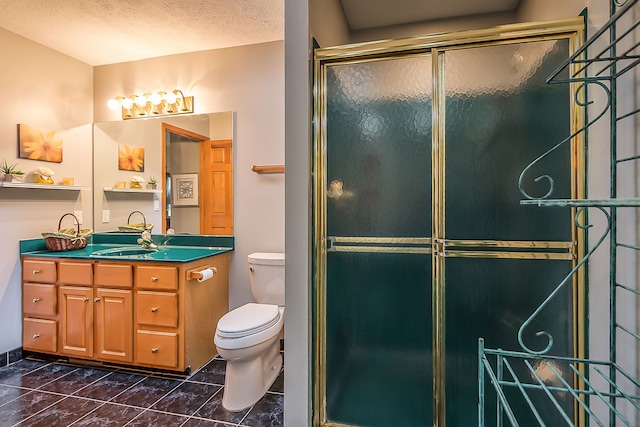 full bathroom with a textured ceiling, vanity, toilet, marble finish floor, and a shower with door