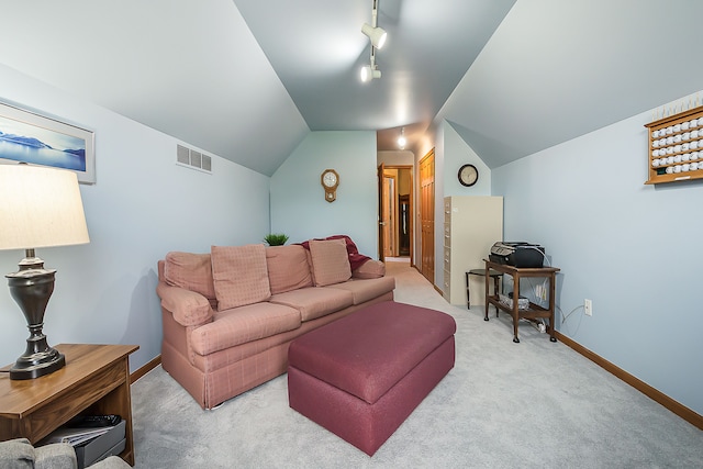 living room with track lighting, light carpet, baseboards, vaulted ceiling, and visible vents