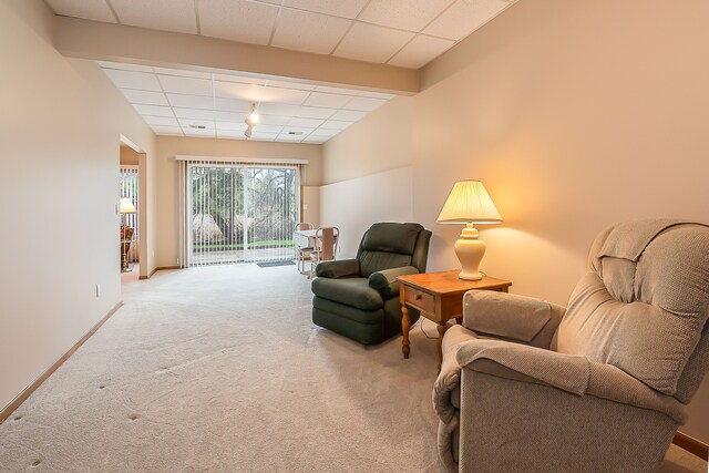 living room with baseboards and carpet flooring