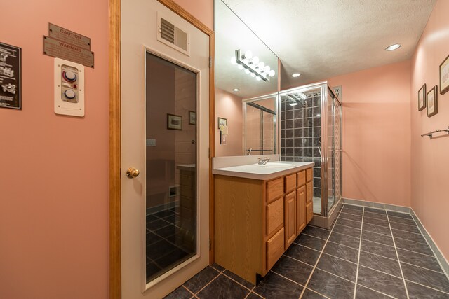 bathroom with vanity, tile patterned floors, recessed lighting, a shower stall, and visible vents