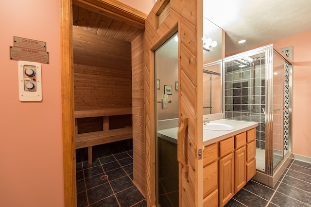 interior space featuring vanity, a sauna, recessed lighting, tile patterned floors, and a shower stall
