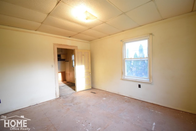 empty room with a paneled ceiling