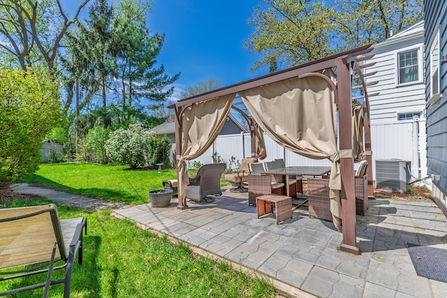 view of patio featuring fence, central AC unit, and outdoor dining space