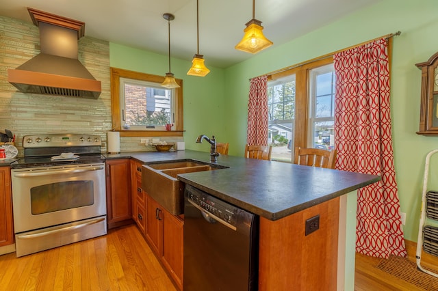 kitchen with brown cabinetry, dark countertops, custom range hood, dishwasher, and stainless steel range with electric cooktop