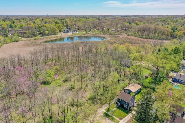 bird's eye view featuring a water view and a wooded view
