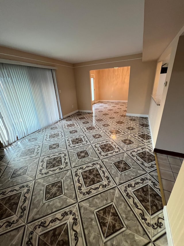 36125 Beverly Dr, Sterling Heights, MI 48310 - tiled spare room featuring baseboards