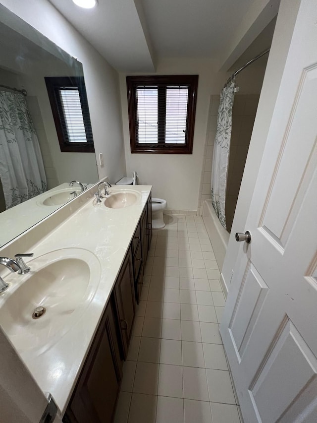 36125 Beverly Dr, Sterling Heights, MI 48310 - bathroom featuring double vanity, a sink, tile patterned floors, and toilet