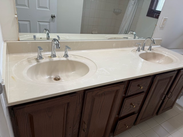 36125 Beverly Dr, Sterling Heights, MI 48310 - full bathroom with double vanity, a sink, and tile patterned floors