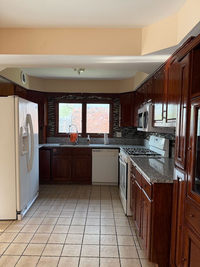 36125 Beverly Dr, Sterling Heights, MI 48310 - kitchen featuring a sink, decorative backsplash, light tile patterned floors, and white appliances