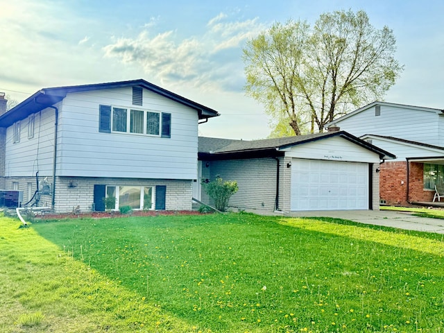 36125 Beverly Dr, Sterling Heights, MI 48310 - tri-level home with a garage, central AC, a front yard, brick siding, and driveway