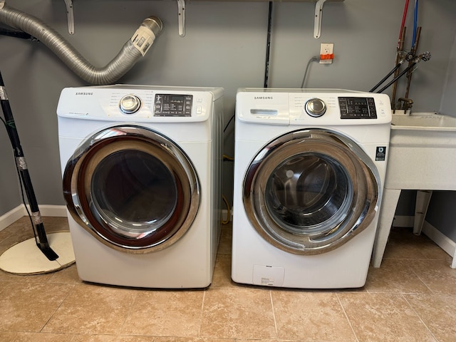 36125 Beverly Dr, Sterling Heights, MI 48310 - washroom with baseboards and independent washer and dryer