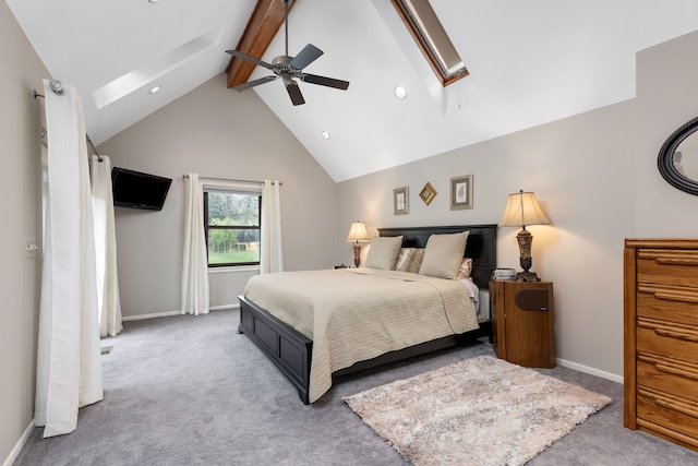 carpeted bedroom featuring baseboards, recessed lighting, lofted ceiling with skylight, and ceiling fan