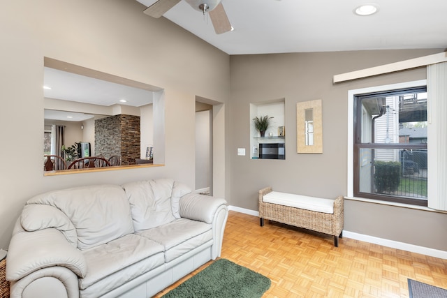 living area with a ceiling fan, baseboards, recessed lighting, and lofted ceiling