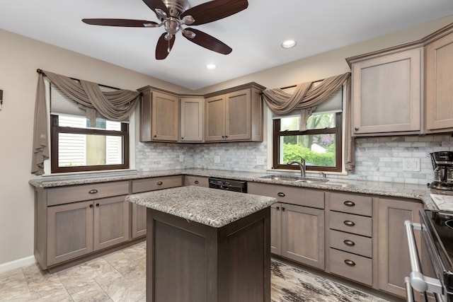 kitchen featuring black dishwasher, a center island, a sink, backsplash, and range with electric cooktop