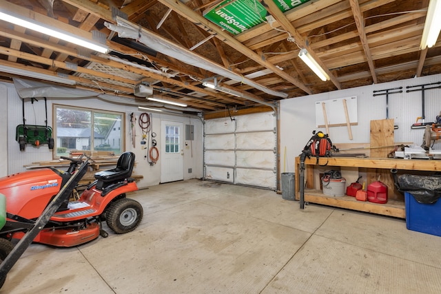 garage featuring a workshop area and a garage door opener