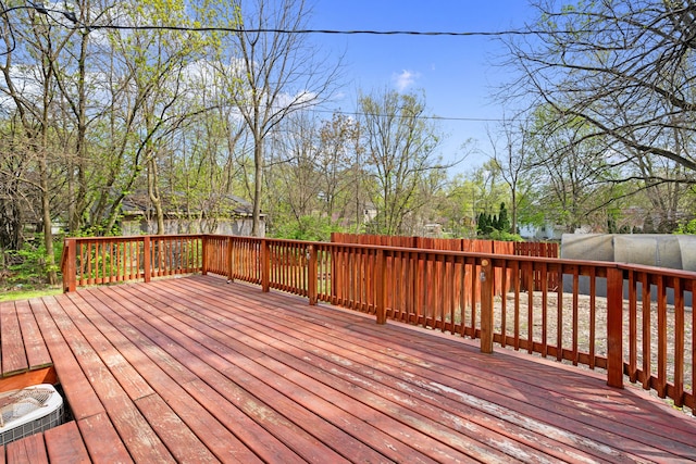 wooden terrace featuring a fenced backyard