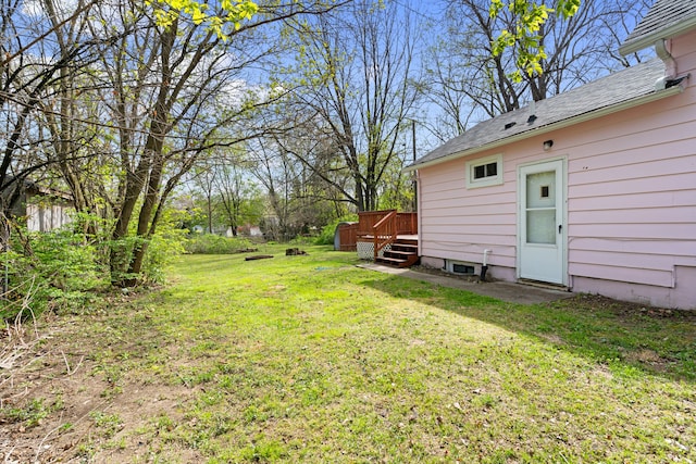 view of yard with a wooden deck