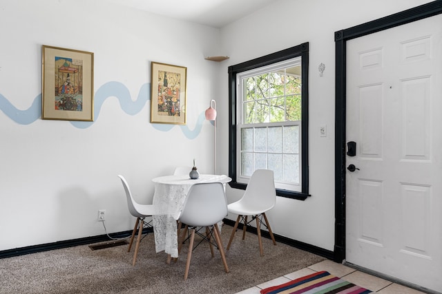 dining room with light tile patterned floors, baseboards, and visible vents