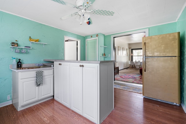 kitchen with freestanding refrigerator, ceiling fan, light wood finished floors, and open shelves
