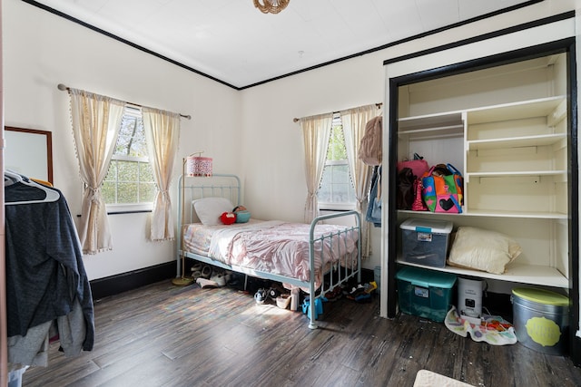 bedroom with wood finished floors