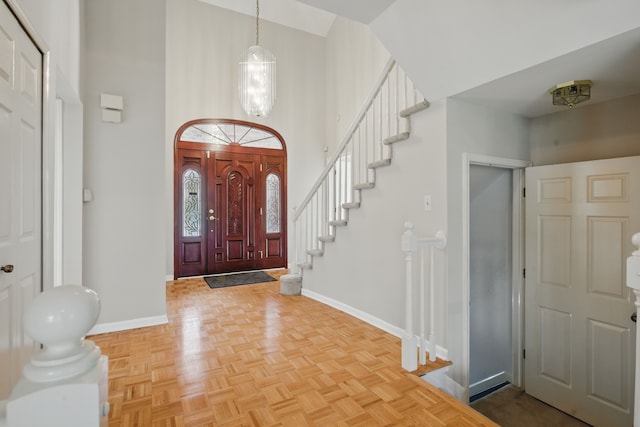 3351 Muerknoll Dr, Troy, MI 48084 - entrance foyer featuring stairs, baseboards, and a towering ceiling