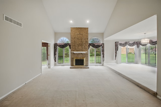 3351 Muerknoll Dr, Troy, MI 48084 - unfurnished living room featuring high vaulted ceiling, carpet flooring, a chandelier, and visible vents