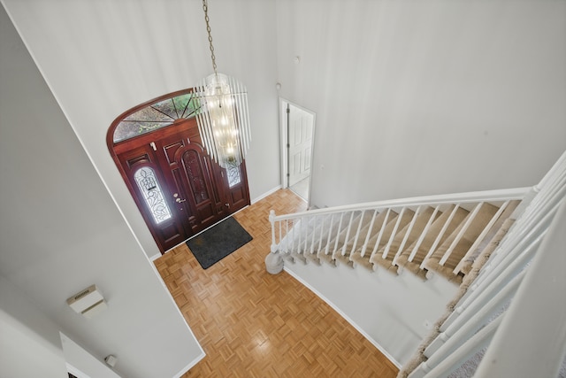 3351 Muerknoll Dr, Troy, MI 48084 - entrance foyer with baseboards, a chandelier, and a towering ceiling