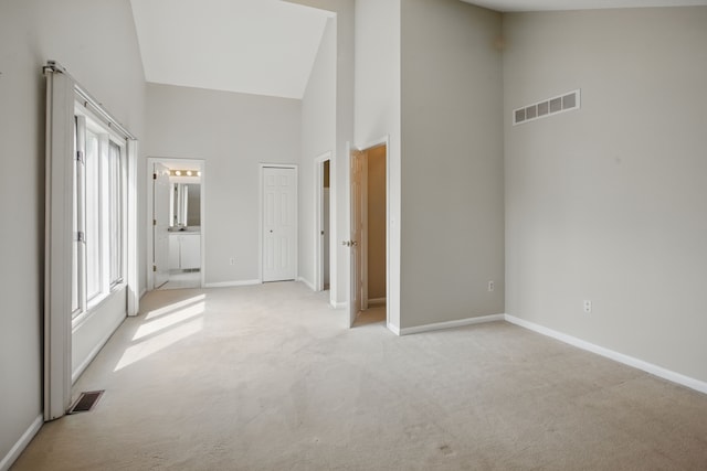 3351 Muerknoll Dr, Troy, MI 48084 - unfurnished bedroom with light colored carpet, high vaulted ceiling, visible vents, and baseboards