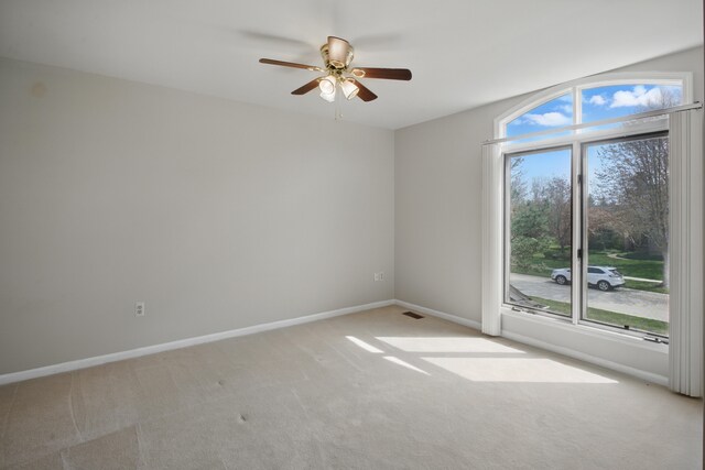 3351 Muerknoll Dr, Troy, MI 48084 - unfurnished room featuring light colored carpet, baseboards, ceiling fan, and visible vents