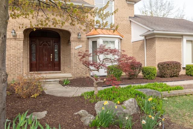 3351 Muerknoll Dr, Troy, MI 48084 - property entrance with a shingled roof and brick siding