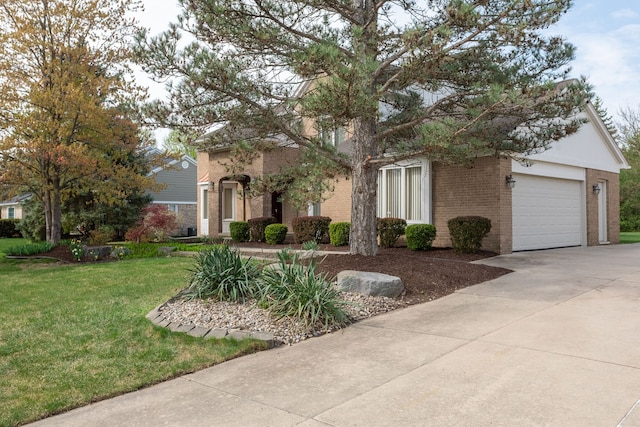 3351 Muerknoll Dr, Troy, MI 48084 - obstructed view of property with an attached garage, concrete driveway, a front lawn, and brick siding
