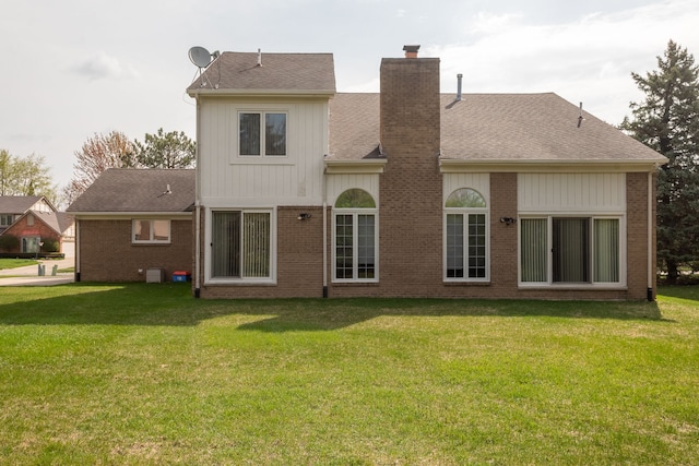 3351 Muerknoll Dr, Troy, MI 48084 - back of property featuring a yard, brick siding, and a chimney