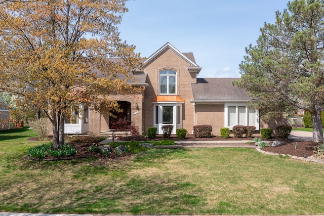 3351 Muerknoll Dr, Troy, MI 48084 - traditional home with roof with shingles, a front yard, and brick siding